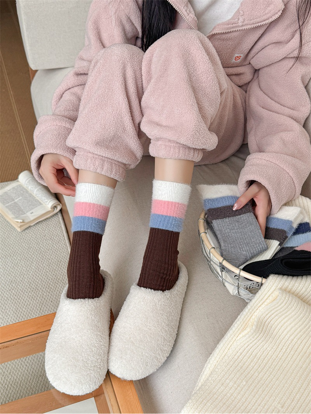 Coffee brown ribbed crew socks with pink and blue striped cuffs worn with plush slippers