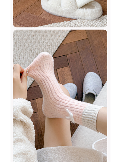 Light pink fuzzy ribbed crew sock stretched across the foot
