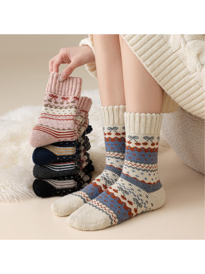 Ivory patterned crew socks worn beside a stack of color options