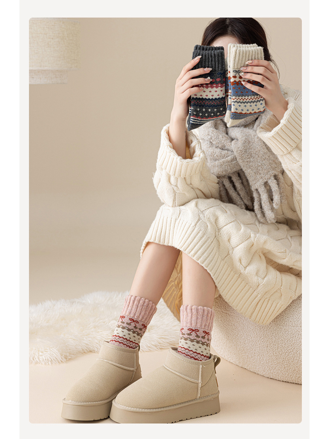 Pink patterned crew socks styled with ankle boots while two other colors are held