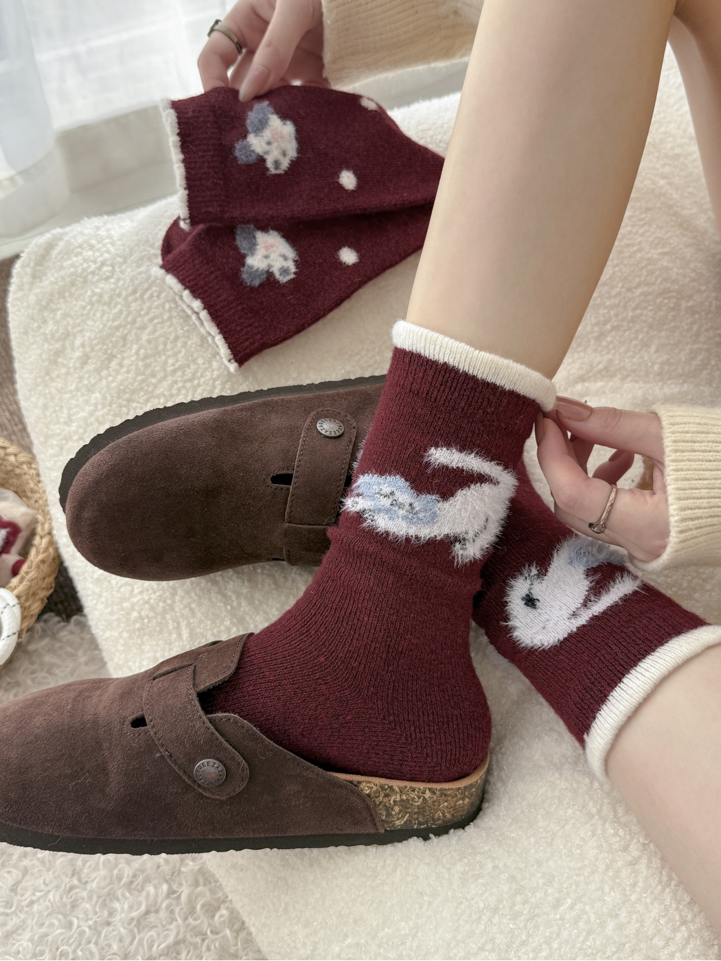 Burgundy animal motif crew socks styled with brown clogs