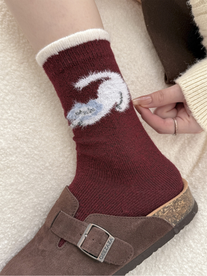 Close-up of the fuzzy curled animal motif and ivory cuff trim