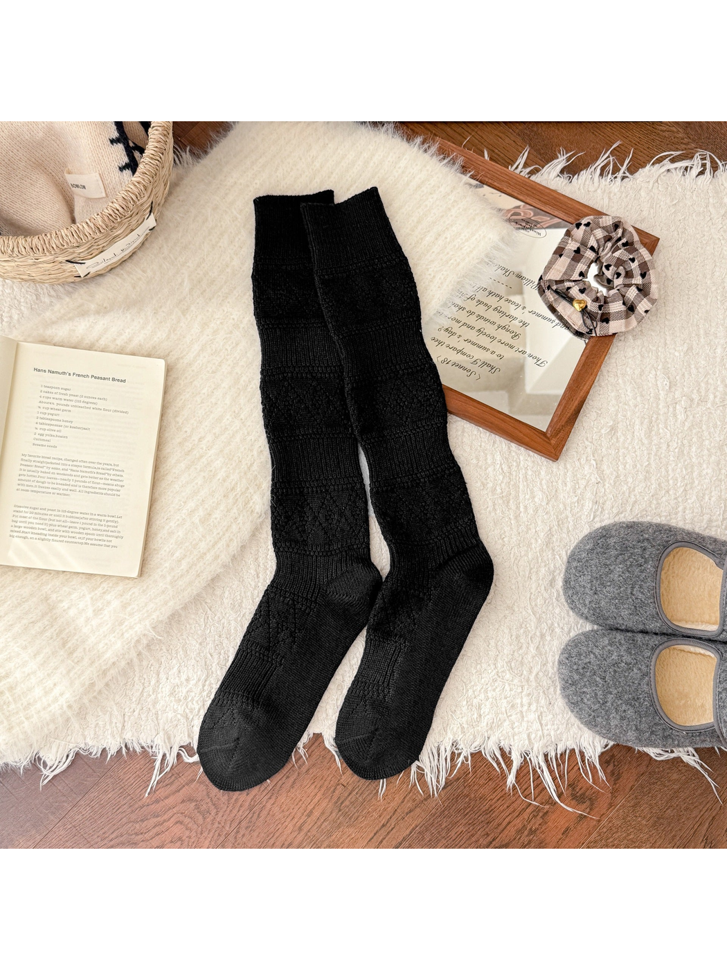 Black knee-high textured socks laid flat