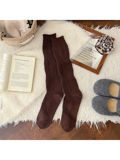 Brown knee-high textured socks laid flat