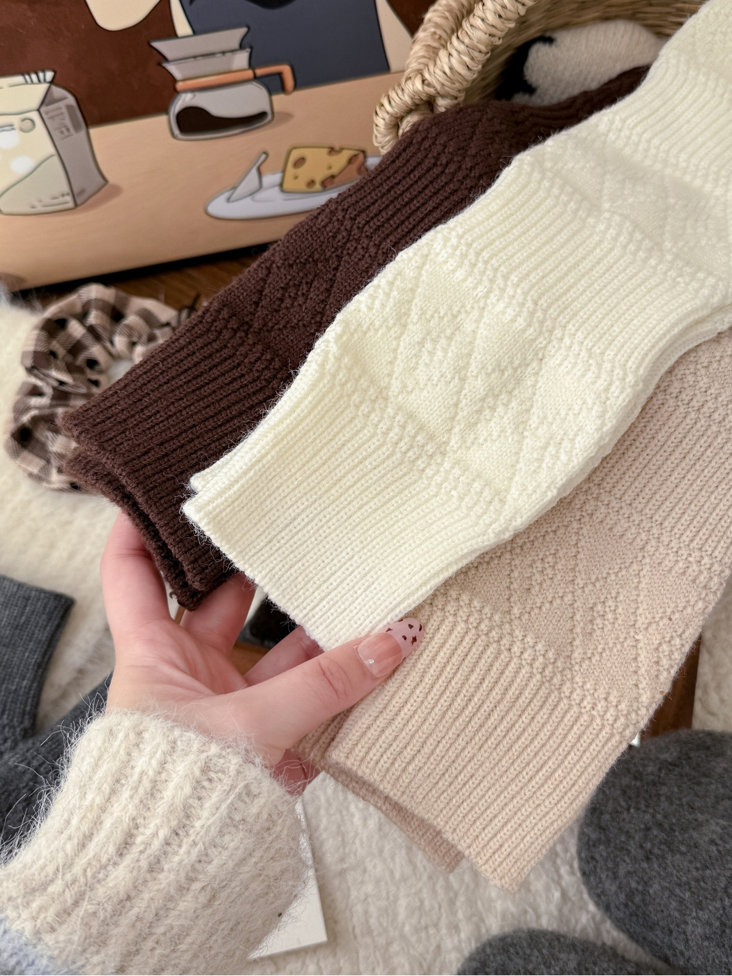Close-up comparison of brown, ivory and beige sock cuffs and knit textures