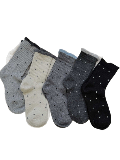 Five colors of ruffled polka-dot crew socks displayed together