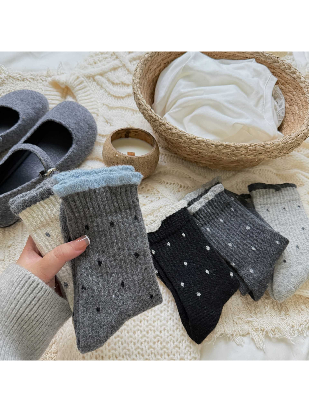 Assorted polka-dot crew socks displayed with neutral accessories