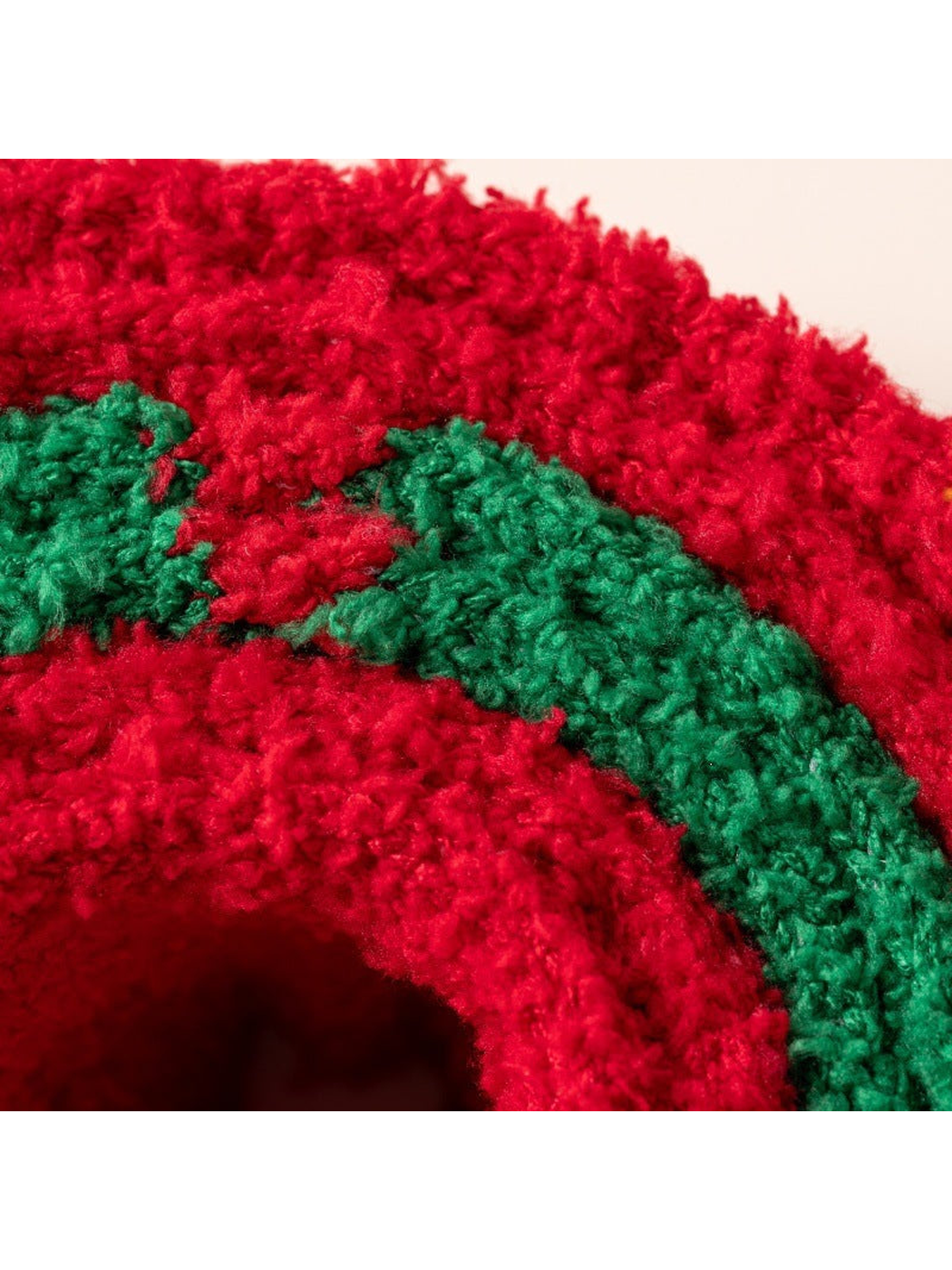 Close-up of the fuzzy red and green looped texture