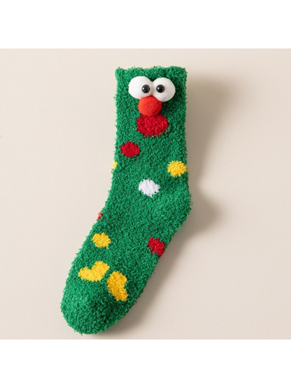 Green fuzzy crew sock with raised eyes, red nose and colorful accents