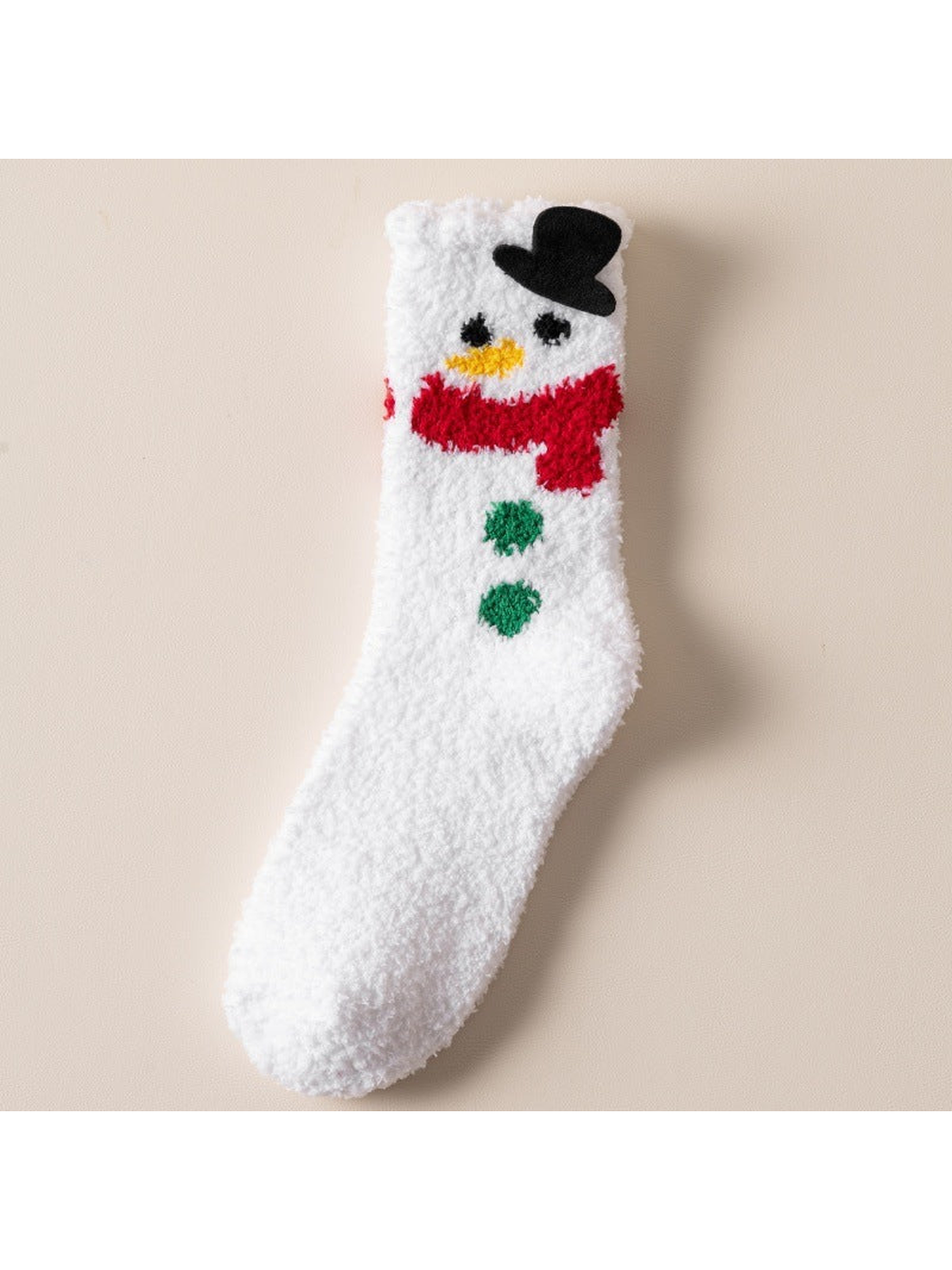 White fuzzy sock with snowman face, black hat and red scarf
