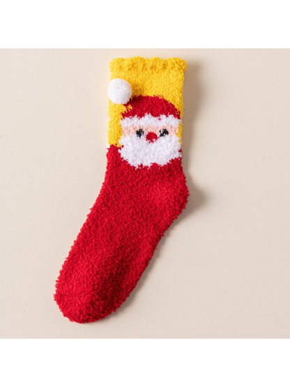 Red fuzzy sock with Santa face, yellow cuff and white pom-poms