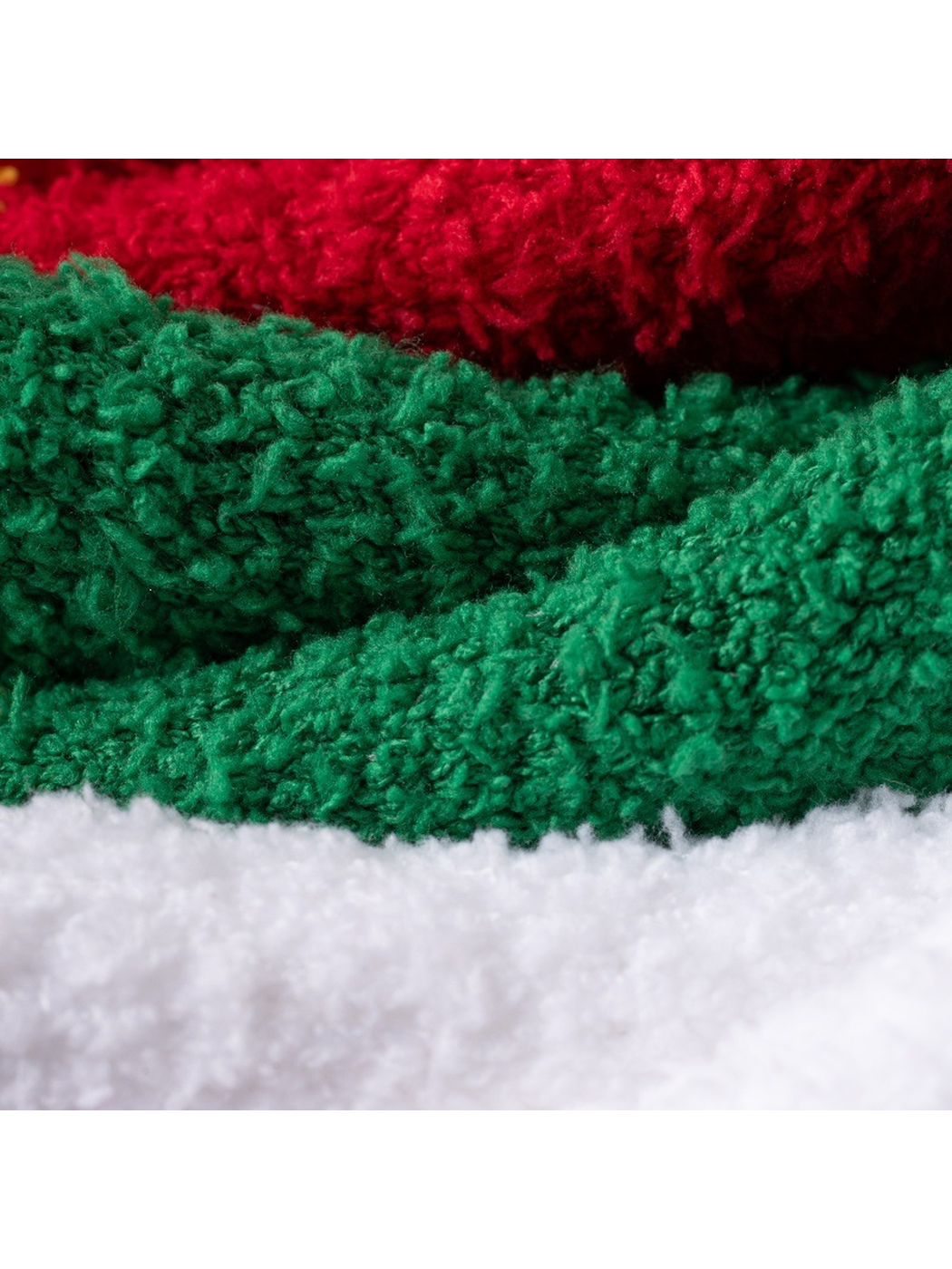 Close-up of the fuzzy green, red and white sock surfaces