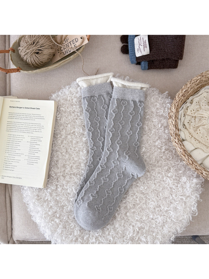 Light gray textured crew socks with ivory rolled cuffs