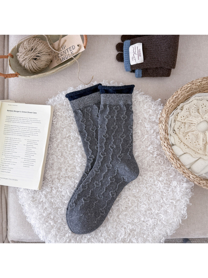 Medium gray textured crew socks with navy rolled cuffs