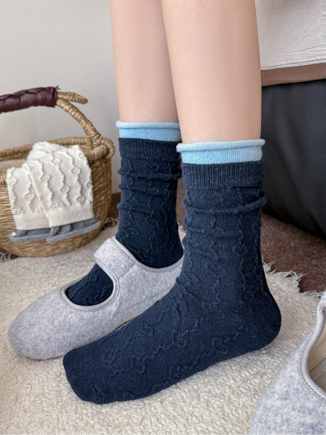 Navy textured crew socks worn with light blue rolled under-cuffs