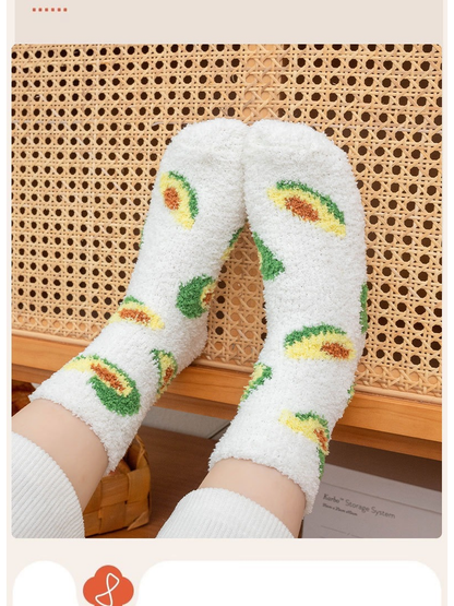 White fuzzy avocado crew socks worn with the soles facing forward