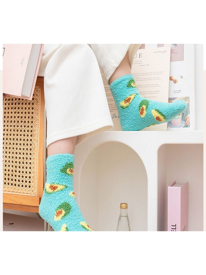 Turquoise fuzzy avocado crew socks worn in a bright indoor setting
