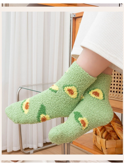 Sage green fuzzy avocado crew socks worn in a side view