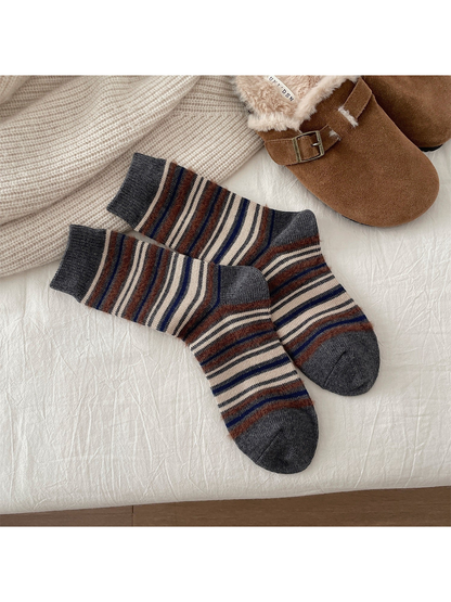 Gray crew socks with brown, navy and cream stripes