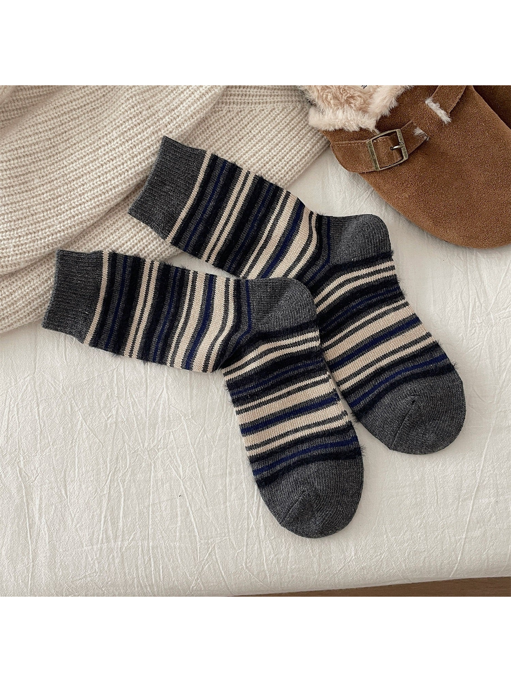 Gray crew socks with navy, black and cream stripes
