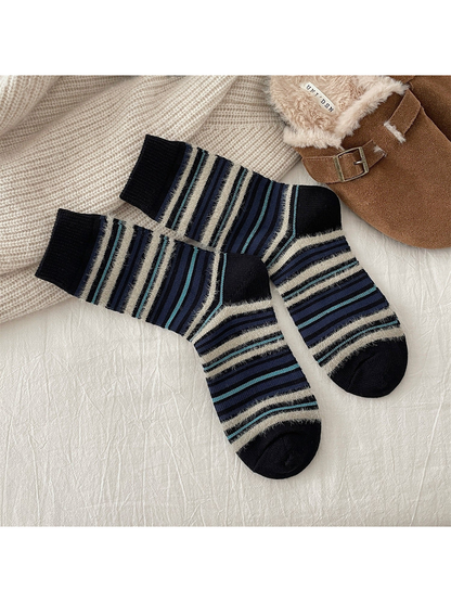 Black crew socks with navy, turquoise and fuzzy cream stripes