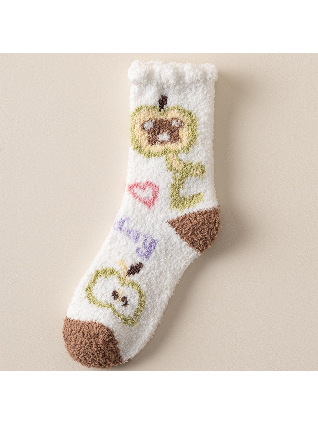 White fuzzy crew sock with green character motifs and brown toe and heel