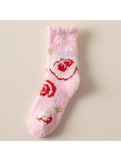 Light pink fuzzy crew sock with bold red spiral motifs