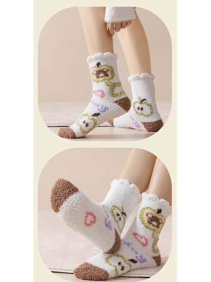 White character-motif fuzzy crew socks worn from front and sole views