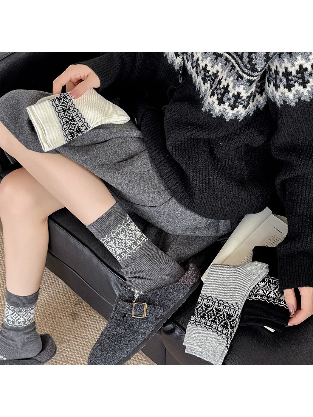 Dark gray geometric crew socks styled with gray clogs and folded color options