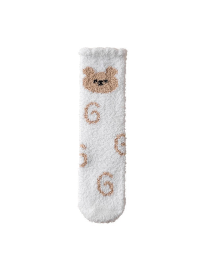 White fuzzy crew sock with beige cat and spiral motifs