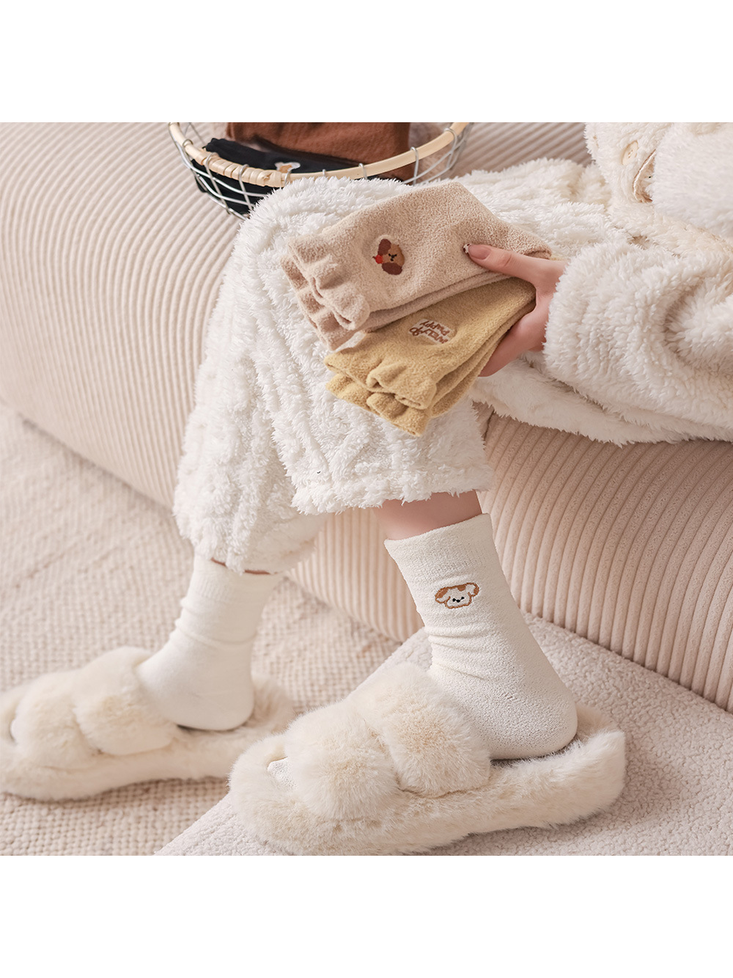Ivory fuzzy crew socks styled with plush slippers and folded color options