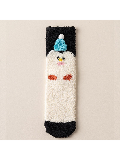 Fuzzy cream crew sock with black trim and penguin motif