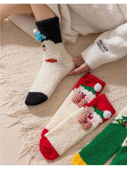 Penguin-motif sock worn beside Santa, tree and reindeer sock styles
