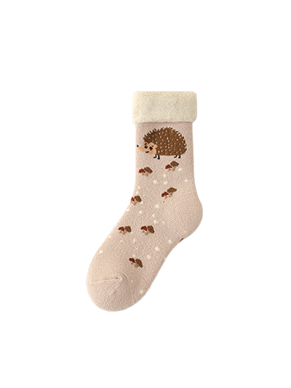 Light pink crew sock with a hedgehog motif, scattered dots, and an ivory cuff