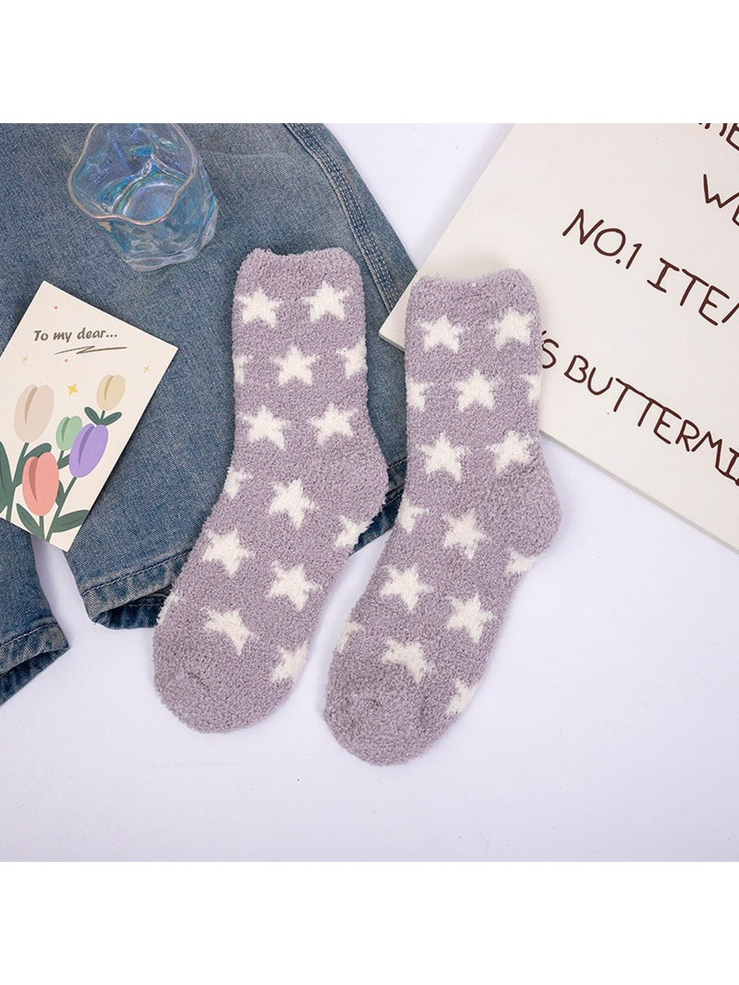 Light purple fuzzy crew socks with repeating white stars