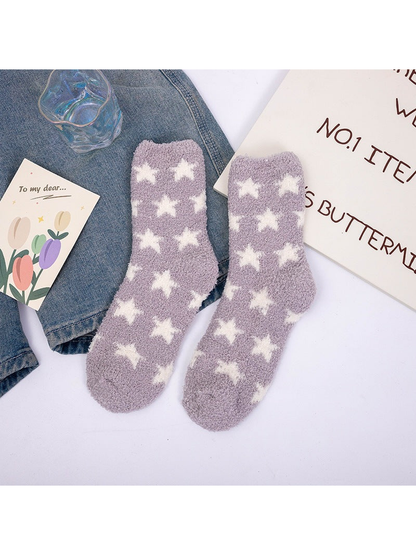 Light purple fuzzy crew socks with repeating white stars