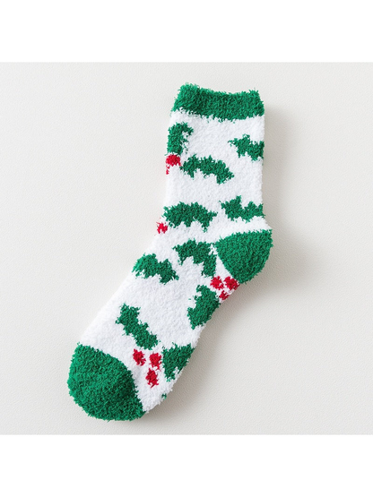 White fuzzy sock with green tree motifs and green trim