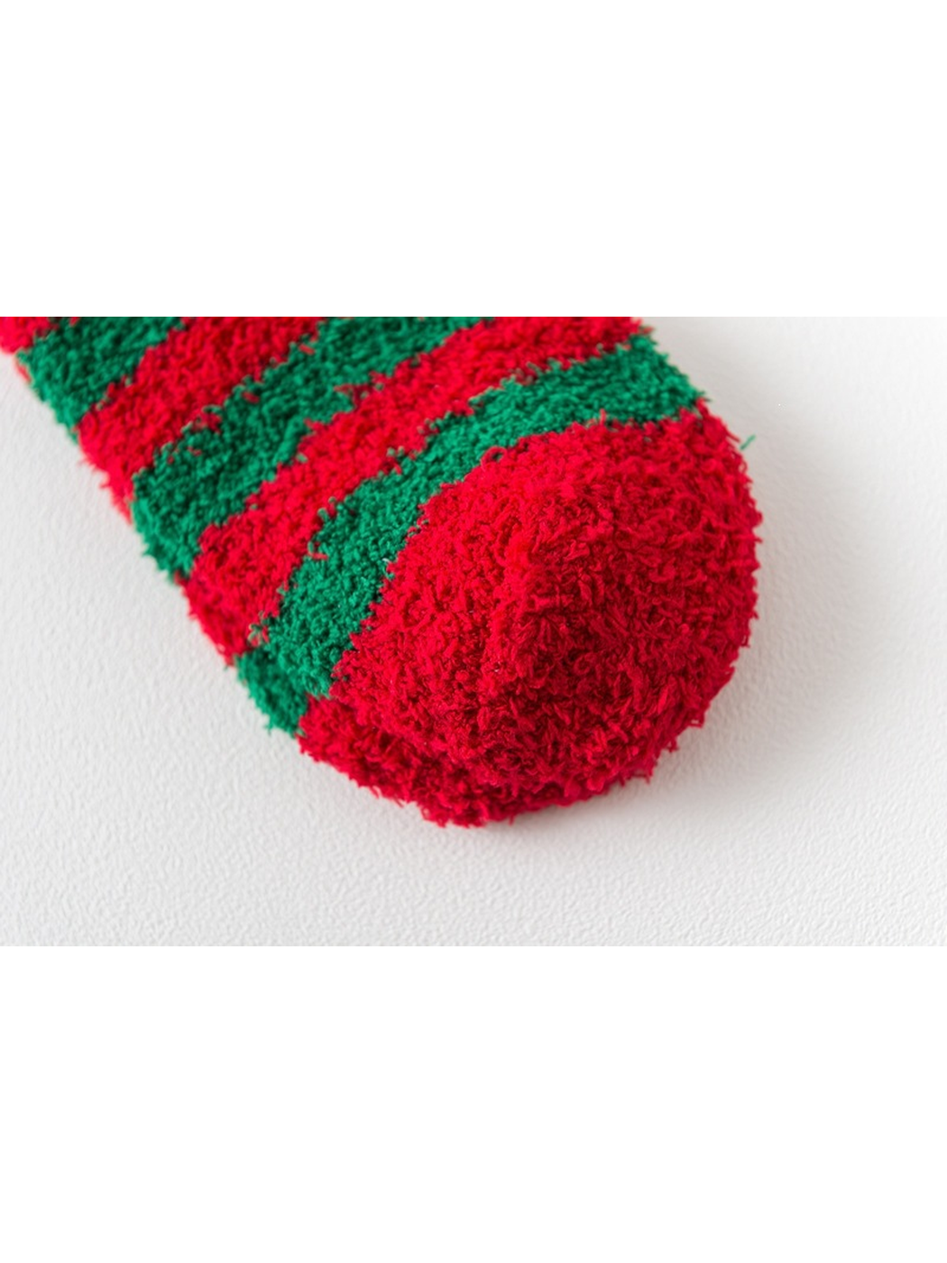 Close-up of the rounded red toe and red and green stripes