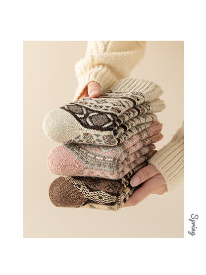 Ivory, pink, and brown geometric-pattern crew socks stacked together