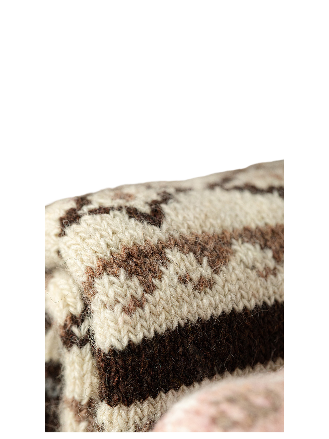 Close-up of the cream and brown geometric knit pattern