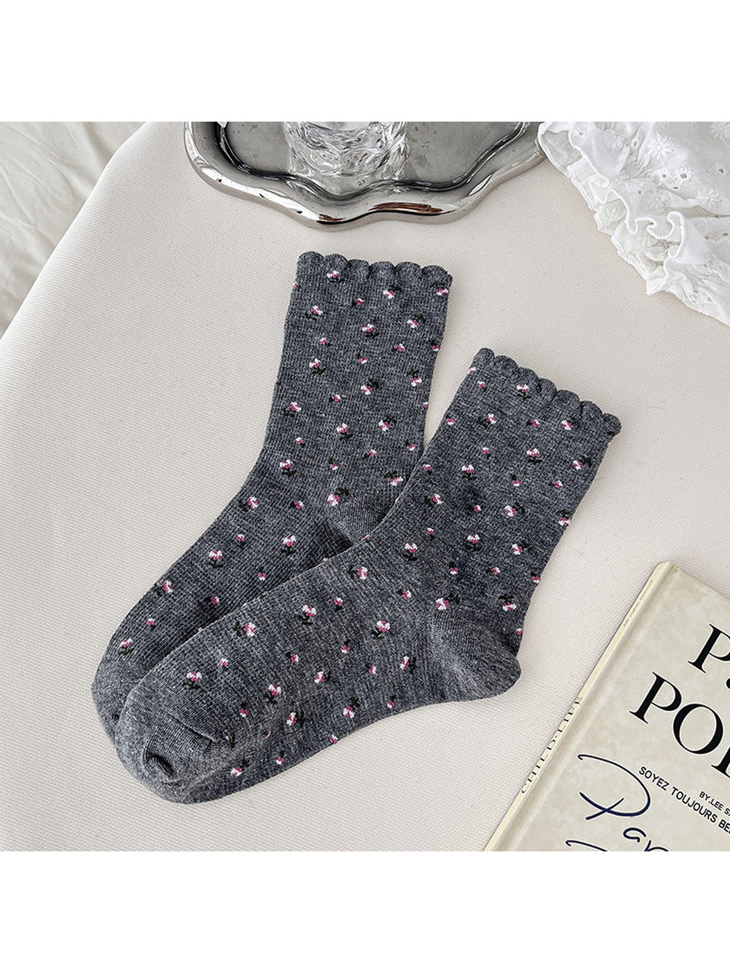 Dark gray crew socks with pink floral sprigs and scalloped cuffs