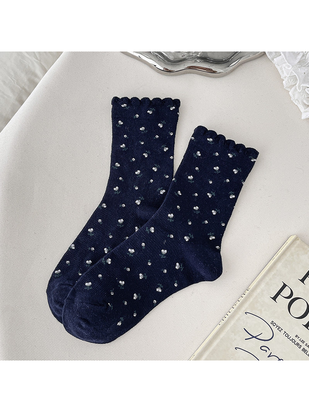 Navy crew socks with small floral sprigs and scalloped cuffs