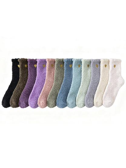 Complete color assortment of fuzzy heart-detail socks in a row