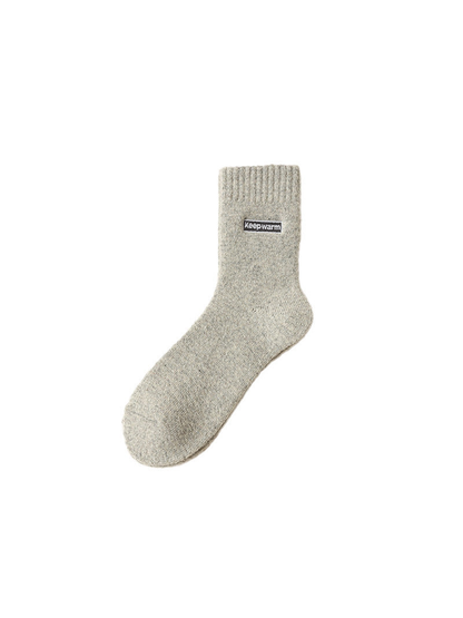 Light gray crew sock with ribbed cuff and label patch