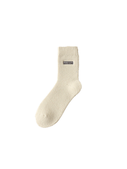 Ivory crew sock with ribbed cuff and label patch