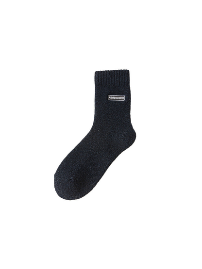 Navy crew sock with ribbed cuff and label patch
