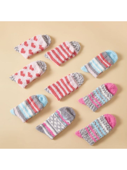 Assorted fuzzy patterned socks arranged in a flat display