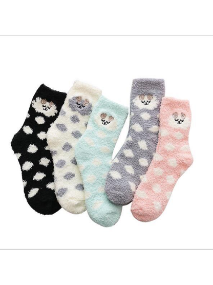 Black, ivory, mint, gray and light pink fuzzy crew socks displayed together