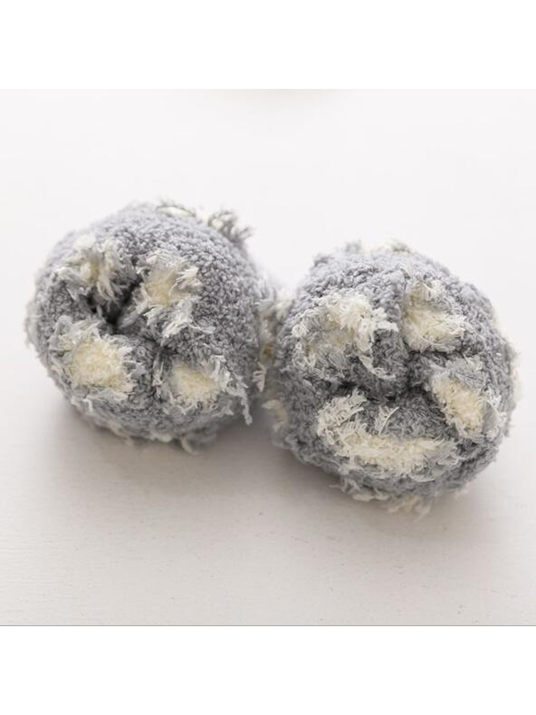 Close-up of the gray fuzzy texture and cream polka dots