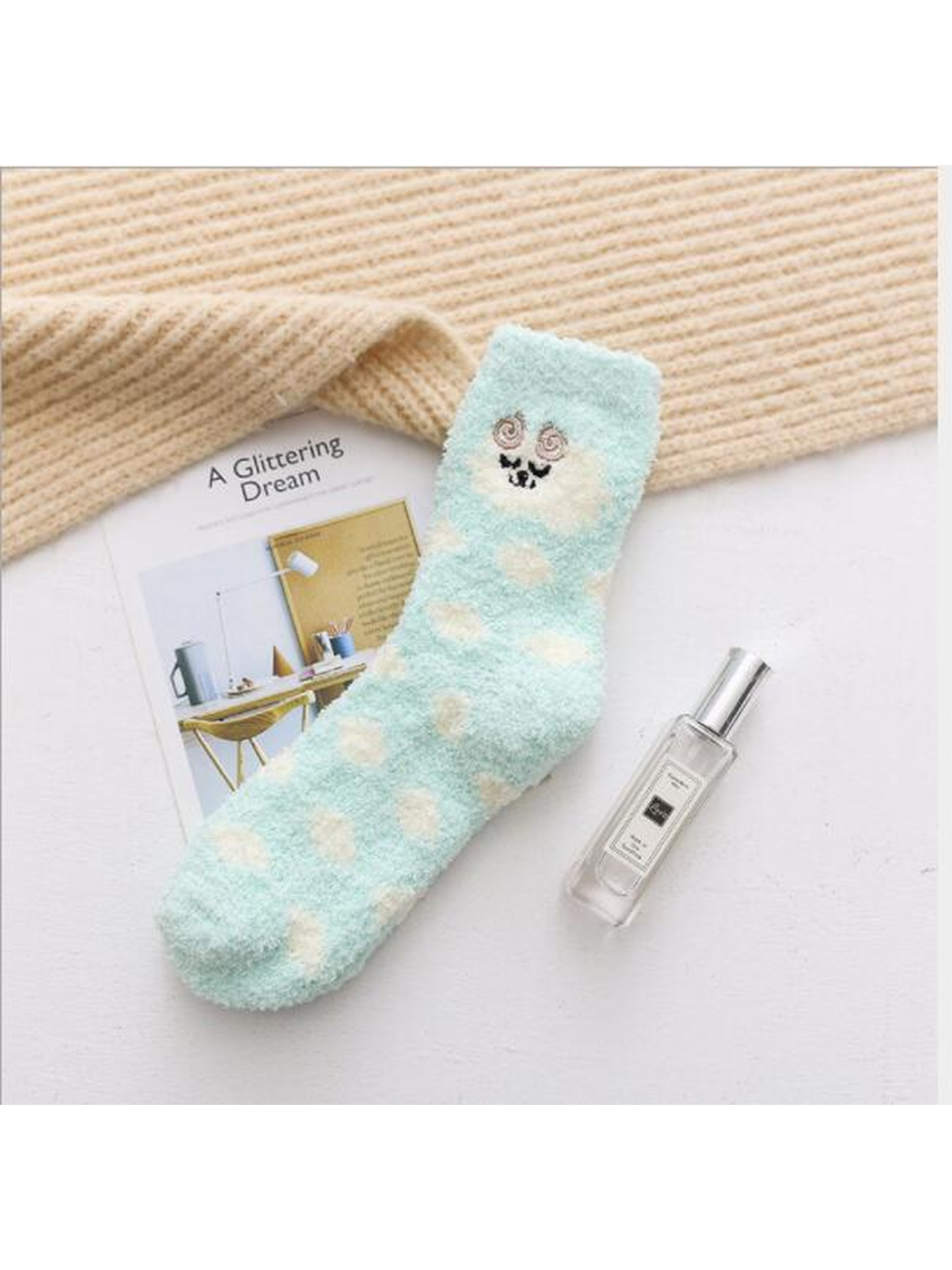 Mint fuzzy crew sock with cream polka dots and embroidered face motif